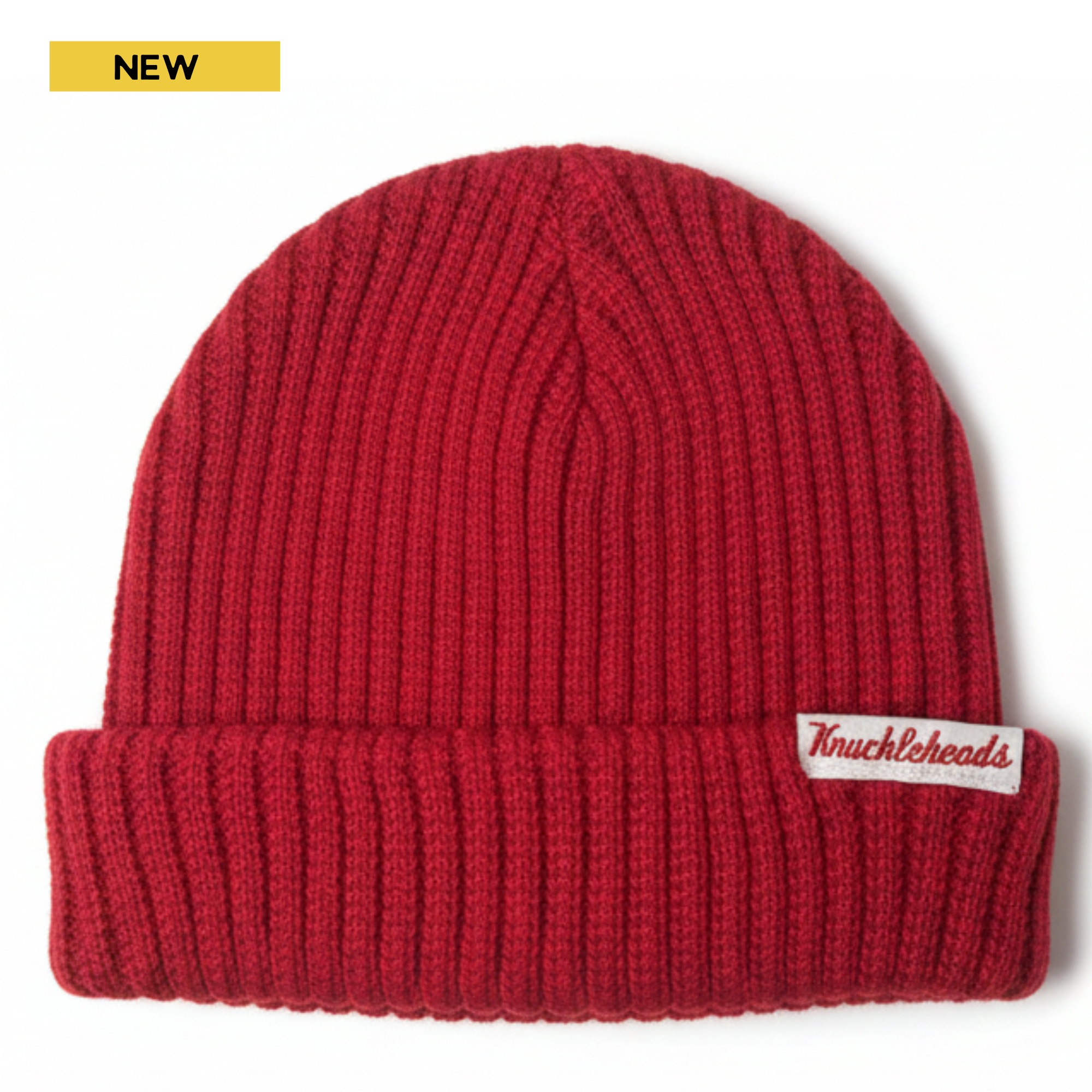 Cozy red knit beanie for infants and toddlers with a stretchy ribbed texture, folded cuff, and signature Knuckleheads tag — a warm, classic winter accessory.