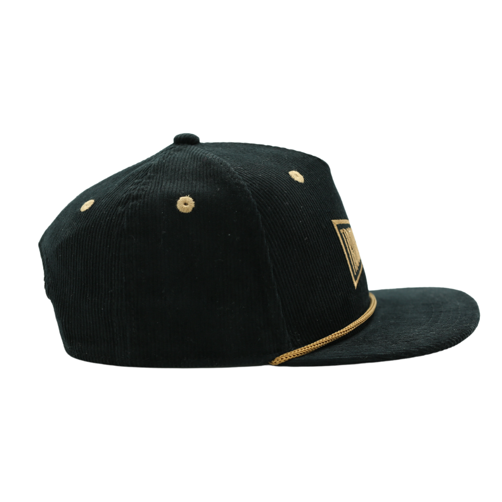 Image of Black with Brown Corduroy Bill Kids Trucker Hat with Troublemaker Patch: A cool and trendy trucker hat designed for kids. The hat features a stylish black crown and a brown bill, adorned with a striking Knuckleheads patch on the front. Elevate your child's style with this fashionable and comfortable accessory, perfect for any adventure or everyday wear. Crafted with care, this black with brown bill trucker hat with a Knuckleheads patch is a must-have addition to their wardrobe.