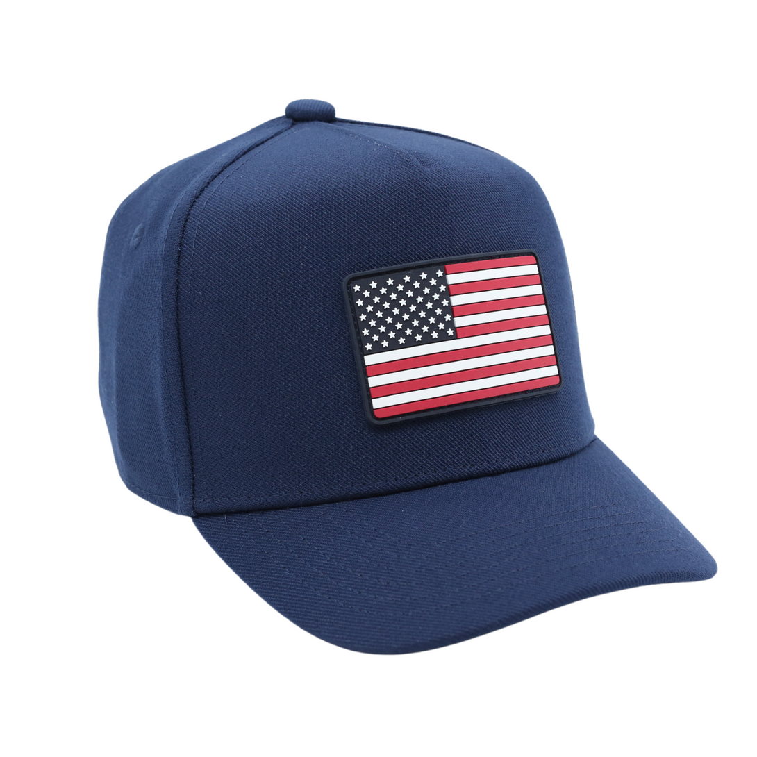 Image of Navy USA Kids Trucker Hat with USA Flag Patch: A patriotic and stylish trucker hat designed for kids. The hat comes in classic navy blue, showcasing a striking USA flag patch on the front. Perfect for young patriots to show their American pride while staying cool and comfortable. Elevate your child's style with this trendy and functional accessory, ideal for outdoor adventures and everyday wear.
