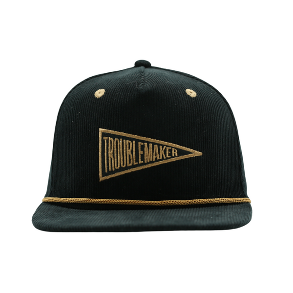 Image of Black with Brown Corduroy Bill Kids Trucker Hat with Troublemaker Patch: A cool and trendy trucker hat designed for kids. The hat features a stylish black crown and a brown bill, adorned with a striking Knuckleheads patch on the front. Elevate your child's style with this fashionable and comfortable accessory, perfect for any adventure or everyday wear. Crafted with care, this black with brown bill trucker hat with a Knuckleheads patch is a must-have addition to their wardrobe.