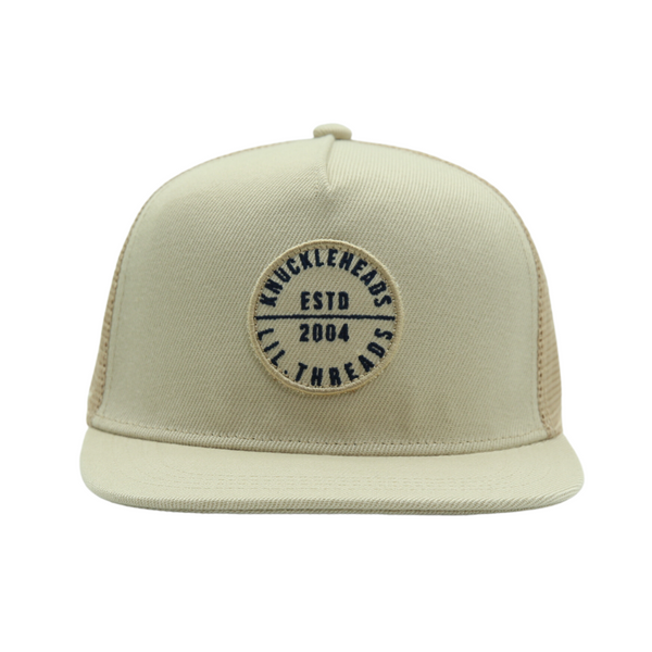 Discover the Tan Kids Trucker Hat, featuring a distinguished Knuckleheads patch and practical sun mesh. This hat is specially designed for children, combining the warm tan color with the classic Knuckleheads patch. The addition of sun mesh provides both style and sun protection. A standout accessory in our collection, it adds flair and practicality to your little one's look.