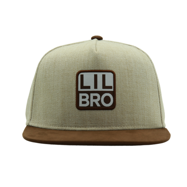 Introducing a Kids Trucker Hat with a 'Lil Bro' patch, a delightful and playful addition to our collection. This hat is designed for children, featuring the adorable 'Lil Bro' patch that lets your little one celebrate their younger sibling status with pride. It's a standout accessory that adds personality and style to your child's look.