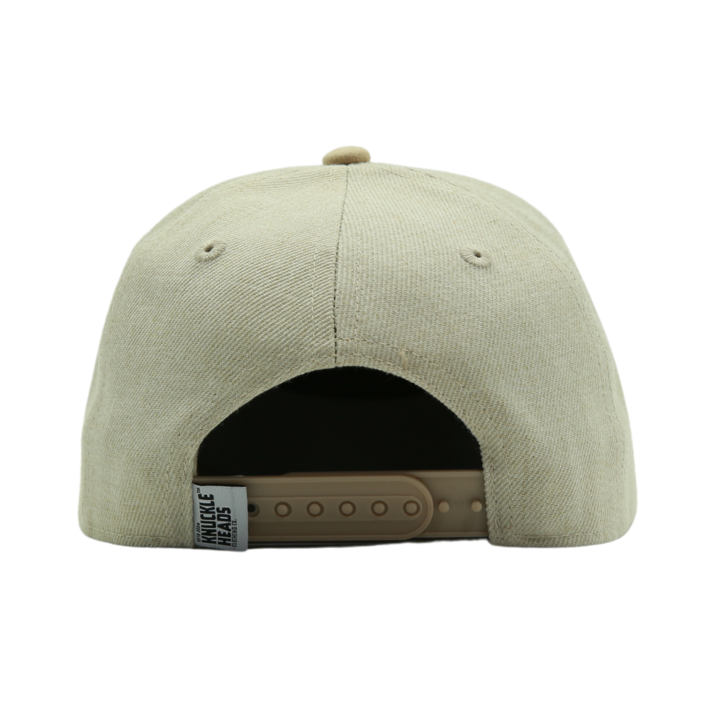 Image of an Oat Kids Trucker Hat featuring a delightful 'Bubs' patch. This charming hat combines a warm and inviting oat hue with the whimsical 'Bubs' patch, making it an attractive choice for children. Crafted with both style and comfort in mind, it's a standout accessory that adds personality to your little one's look.