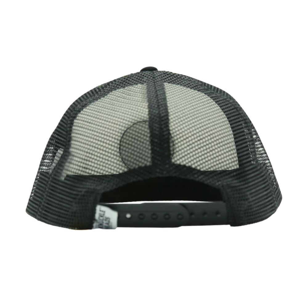 Presenting a Black and White Kids Trucker Hat featuring a classic Knuckleheads patch and practical sun mesh. This hat is designed for children, combining the timeless appeal of black and white with the iconic Knuckleheads patch. The addition of sun mesh provides both style and sun protection. A standout accessory in our collection, it adds flair and practicality to your little one's look.