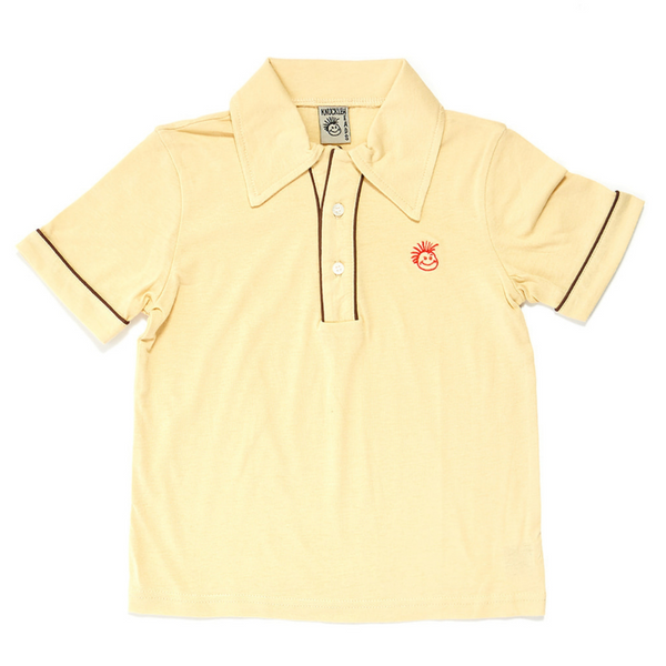 Image of Off-White Kids T-Shirt with Knuckleheads Logo: A stylish and versatile addition to kids' wardrobes. This off-white-colored t-shirt features the iconic Knuckleheads logo on the front. Keep your child's style on point with this comfortable shirt, perfect for adding a touch of character to their outfits.