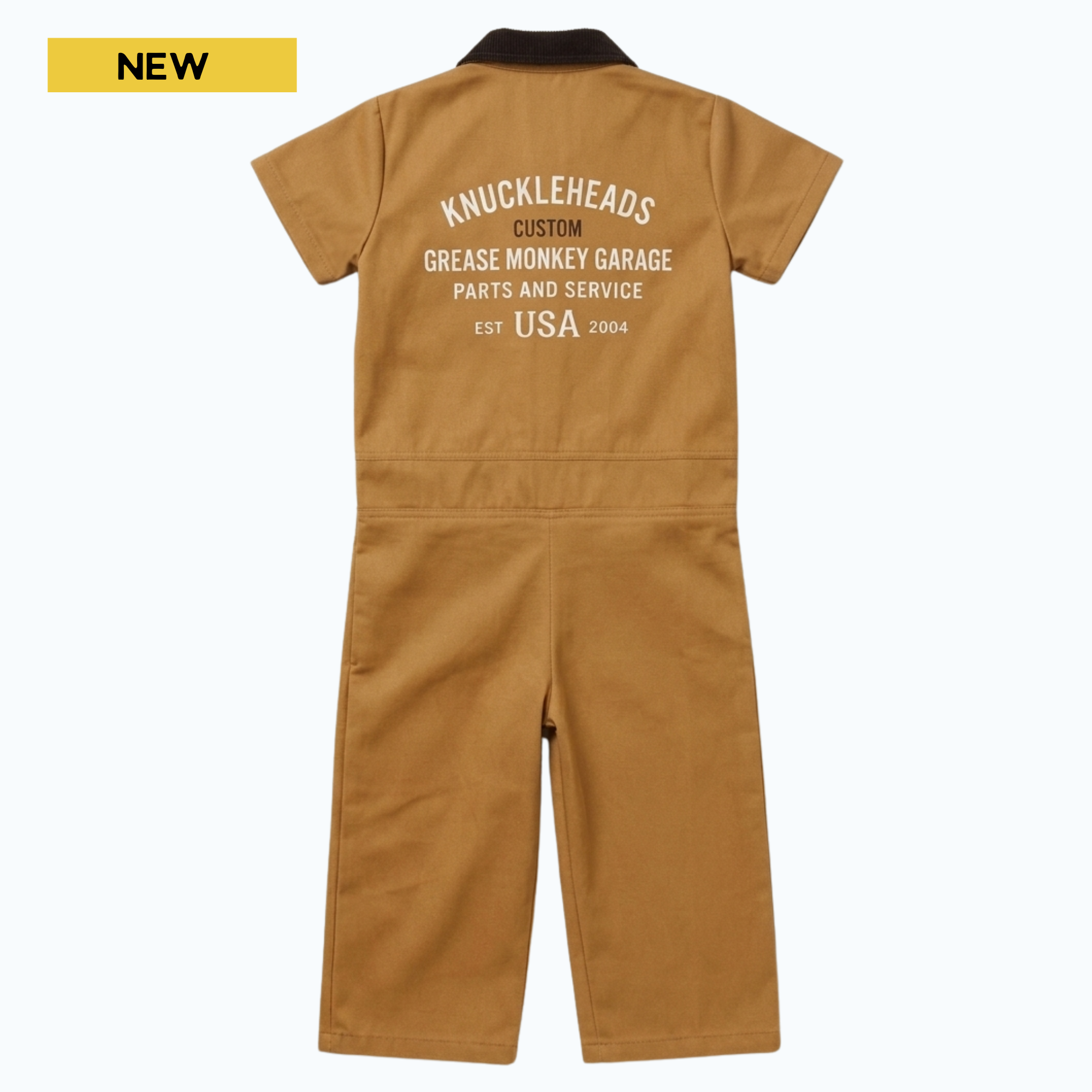 Back view of kids’ vintage tan garage coveralls featuring a dark brown corduroy collar and large Knuckleheads Grease Monkey Garage graphic print on the back.