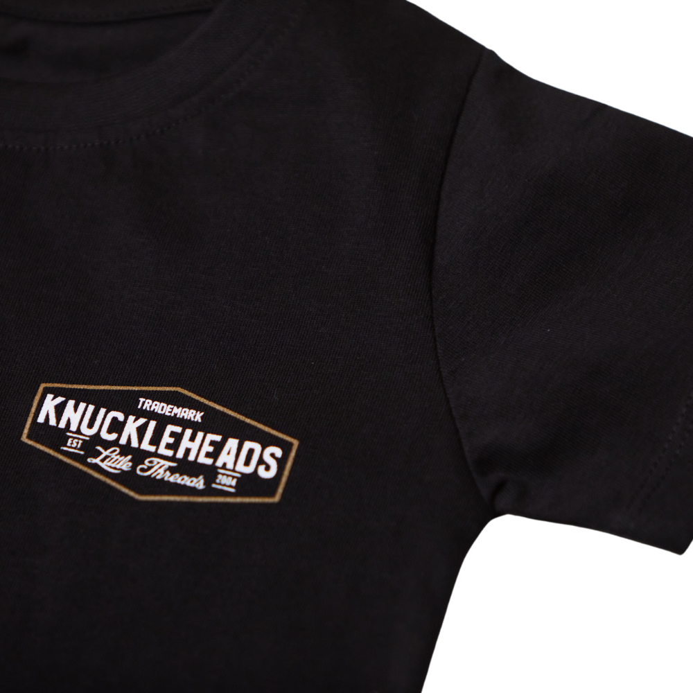 Image of Knuckleheads Black Classic Logo T-Shirt: A bold and stylish black tee featuring the iconic Knuckleheads logo. Crafted with premium materials for comfort and durability, this shirt is a versatile and fashionable choice for kids. The perfect statement piece for little fashionistas or cool dudes to stand out with confidence.
