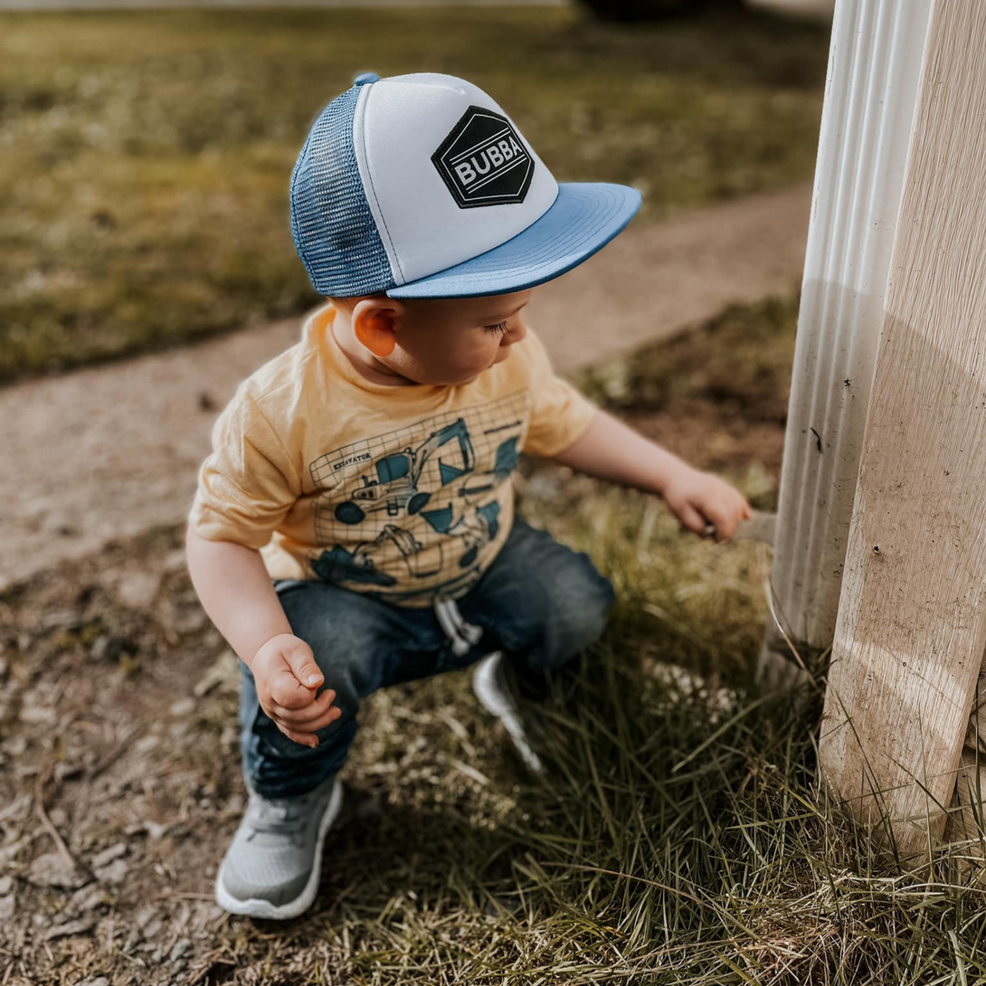 Image of Blue Kids Trucker Hat with 'Bubba' Patch: A vibrant and stylish accessory designed for kids. In a cool blue shade, it features a playful 'Bubba' patch on the front. Elevate your child's style with this fashionable hat, perfect for adding a pop of color to their outfits. Crafted with care, this blue kids trucker hat with the 'Bubba' patch is a must-have addition to their wardrobe, suitable for various occasions and everyday wear.