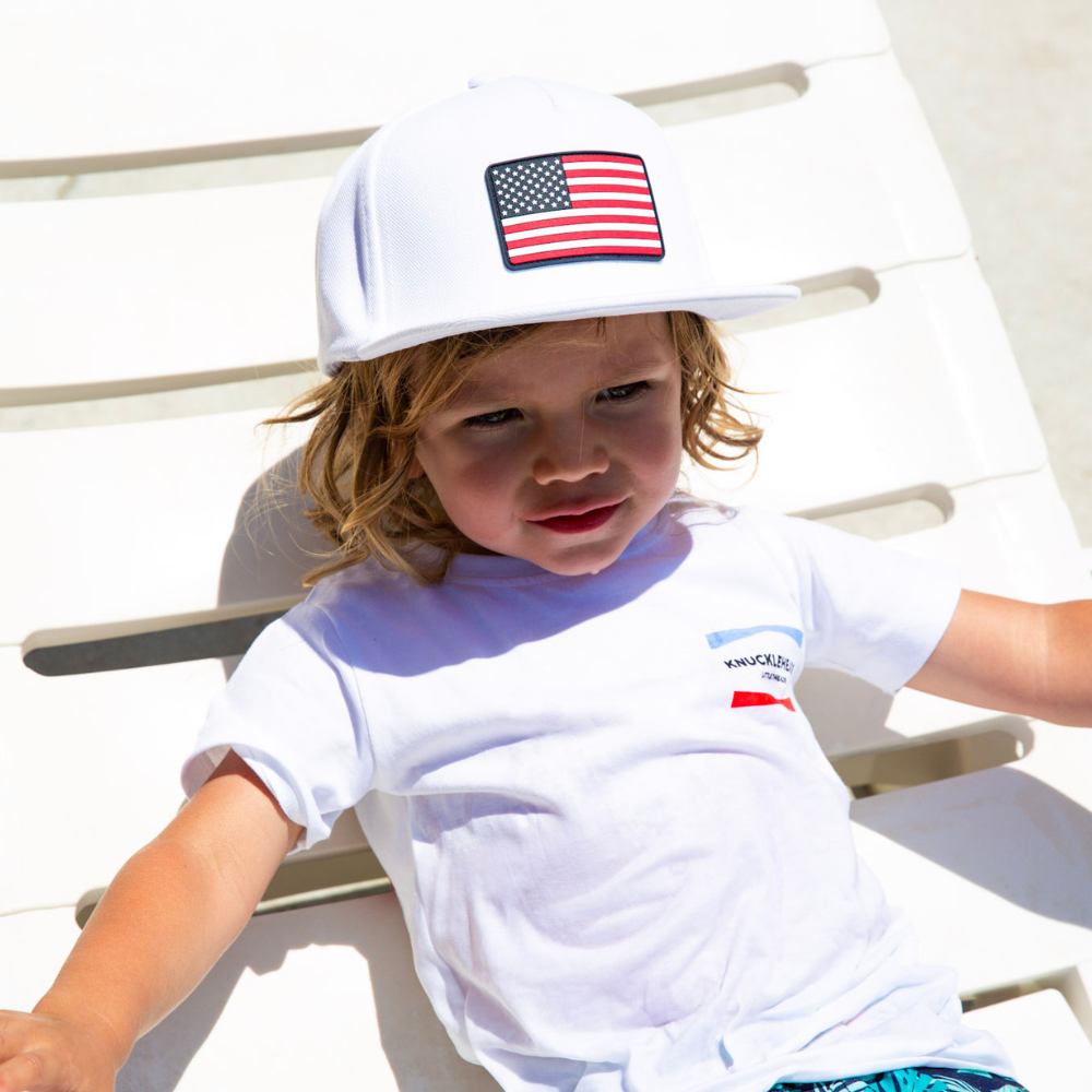 Image of "Merica Kids T-Shirt": A vibrant and trendy tee celebrating American spirit with stars and stripes design. Made of soft cotton for all-day comfort and durability. Perfect for Independence Day and beyond, expressing patriotic pride. Ideal for active kids, showcasing their love for the USA in style.