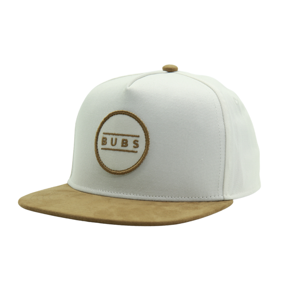 Introducing the Off-White Kids Trucker Hat with a charming 'Bubs' patch. This hat showcases a clean and versatile off-white hue, elegantly accented by the endearing 'Bubs' patch. Designed especially for kids, it's a standout accessory in our collection, adding a touch of personality and flair to your little one's look.
