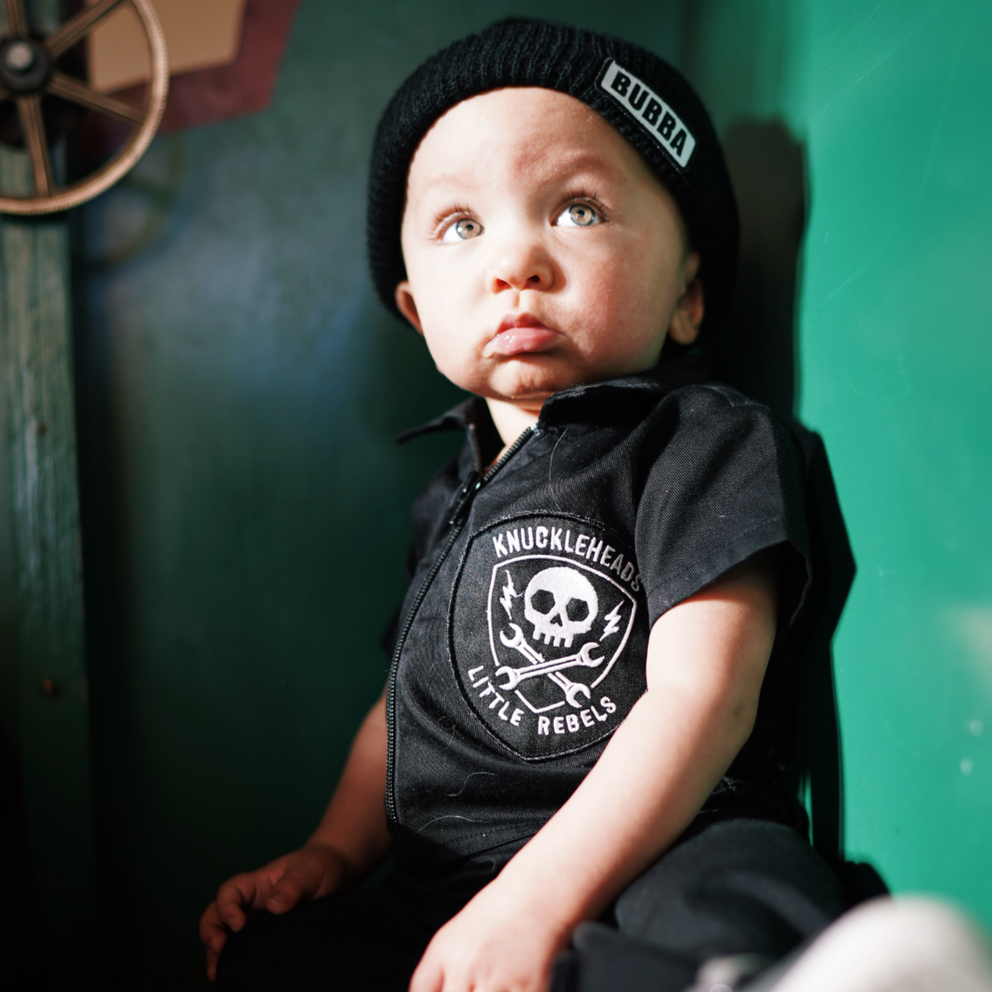 Infant wearing Bubba black beanie winter hat with BUBBA logo by Knuckleheads Clothing