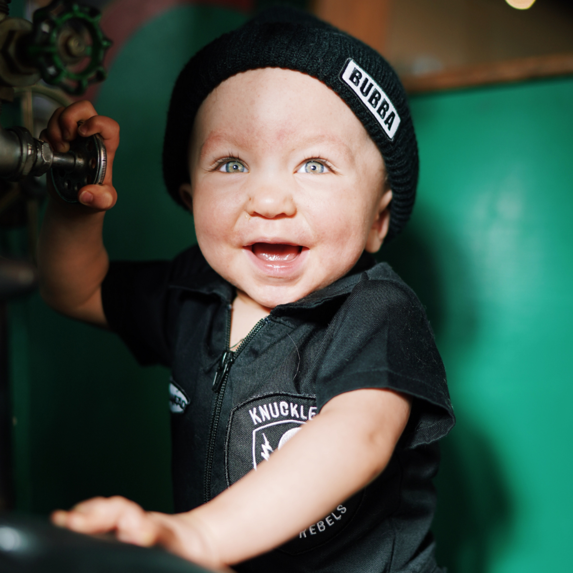 Infant wearing Bubba black beanie winter hat with BUBBA logo by Knuckleheads Clothing