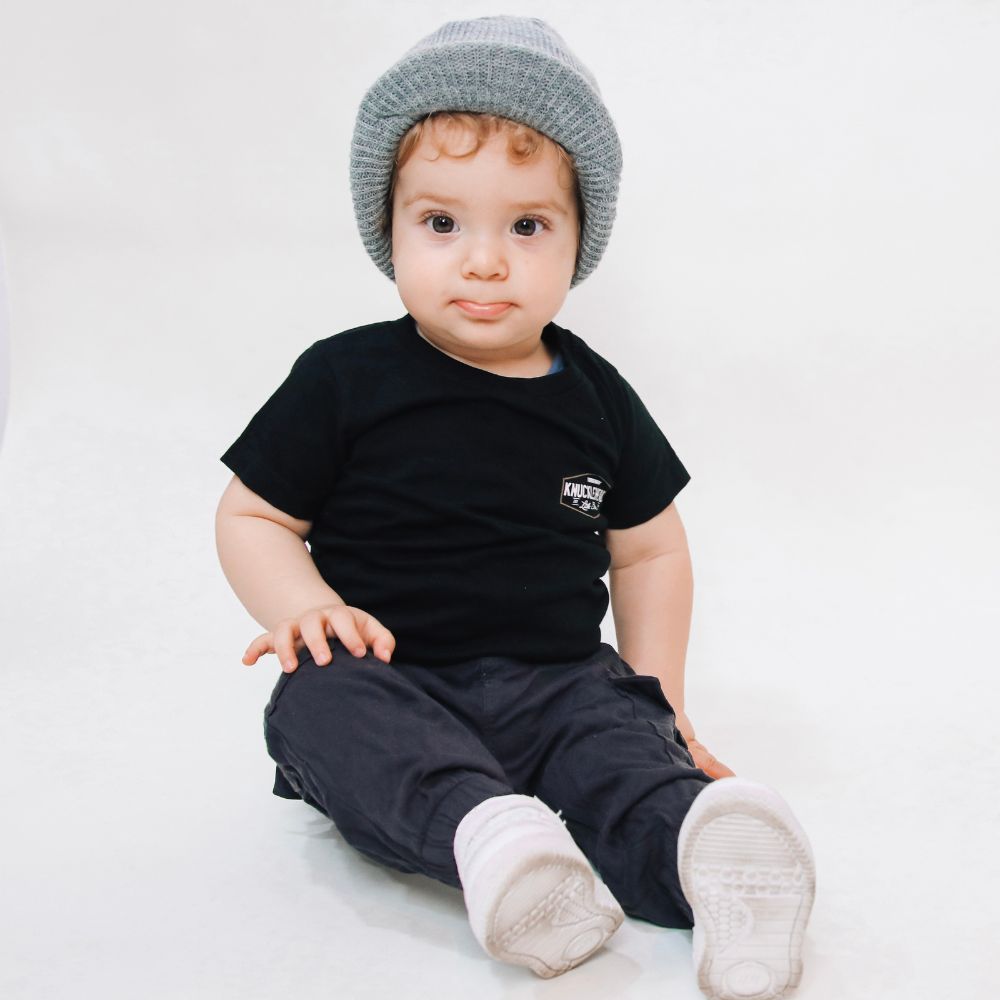 Image featuring a grey beanie with a visor and Knuckleheads patch, specially designed for children. This versatile beanie combines a practical visor with the distinctive Knuckleheads patch, making it a great fit for infants and toddlers. A unique addition to the collection of Infant hats, combining functionality and charm seamlessly.