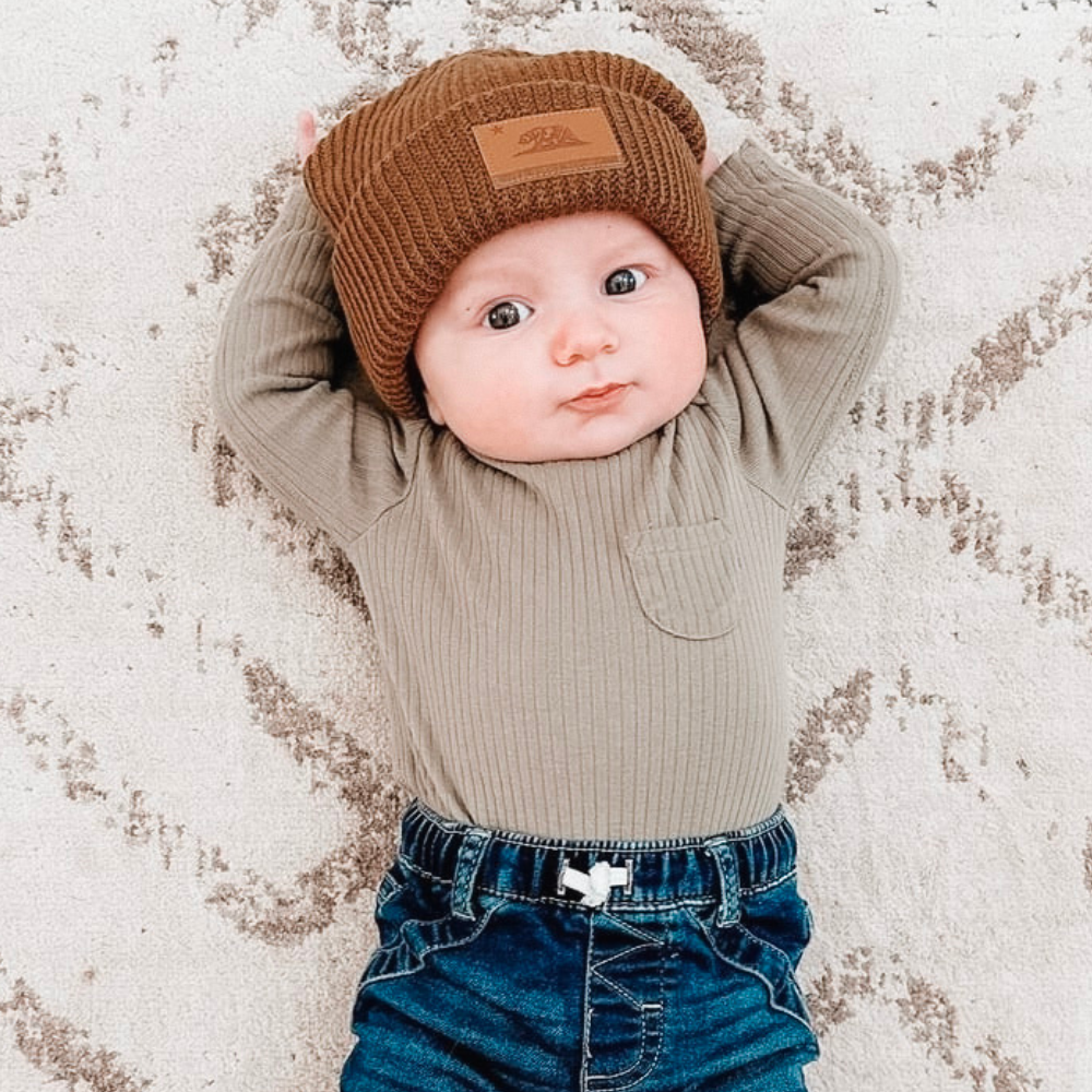 Image of Brown Kids Beanie with California Republic Logo: A stylish and cozy accessory for kids. In a charming green color, it proudly displays the California Republic logo on the front. Keep your child both trendy and warm with this fashionable beanie, perfect for adding a touch of West Coast flair to their outfits.