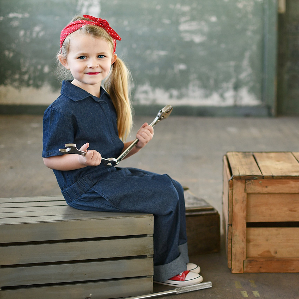 This image showcases delightful denim kids' coveralls adorned with a charming Knuckleheads patch, adding a touch of whimsy to your child's wardrobe. These coveralls are not only fashionable but also comfortable, making them an ideal choice for your little one's everyday adventures.