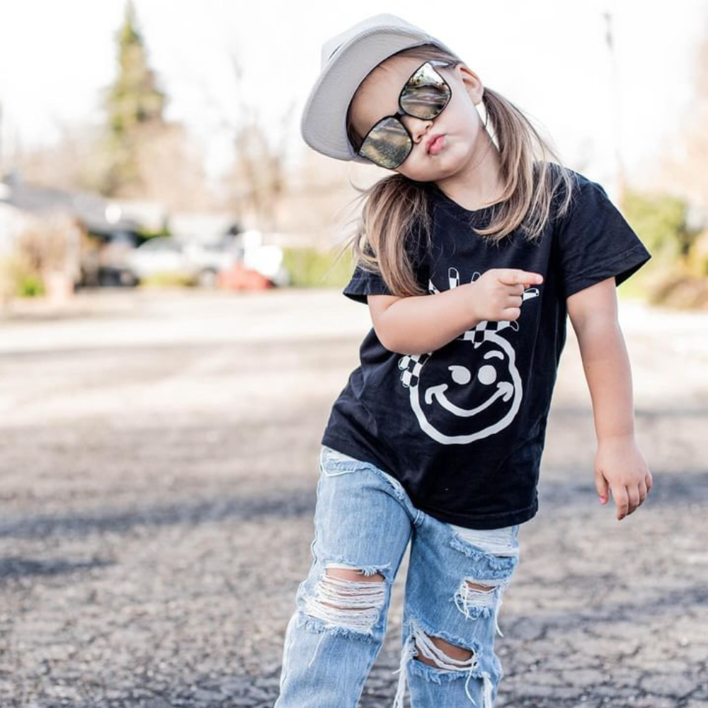 Elevate your child's style with our Hazel Sunglasses For Kids, featuring a sleek Black finish and iconic Knuckleheads logo on the temples. Crafted with excellent quality and UV protection, they're designed to fit all sizes comfortably and delivered in a fabric pouch for added convenience.