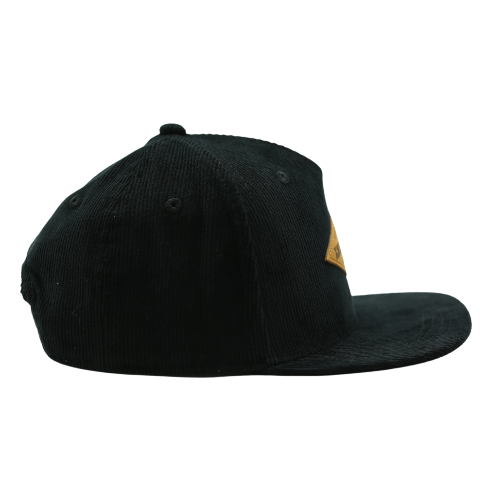 Image of Black Corduroy Bill Kids Trucker Hat with Knuckleheads Patch: A cool and trendy trucker hat designed for kids. The hat features a stylish black crown and a black bill, adorned with a striking Knuckleheads patch on the front. Elevate your child's style with this fashionable and comfortable accessory, perfect for any adventure or everyday wear. Crafted with care, this grey with grey bill trucker hat with a Knuckleheads patch is a must-have addition to their wardrobe.