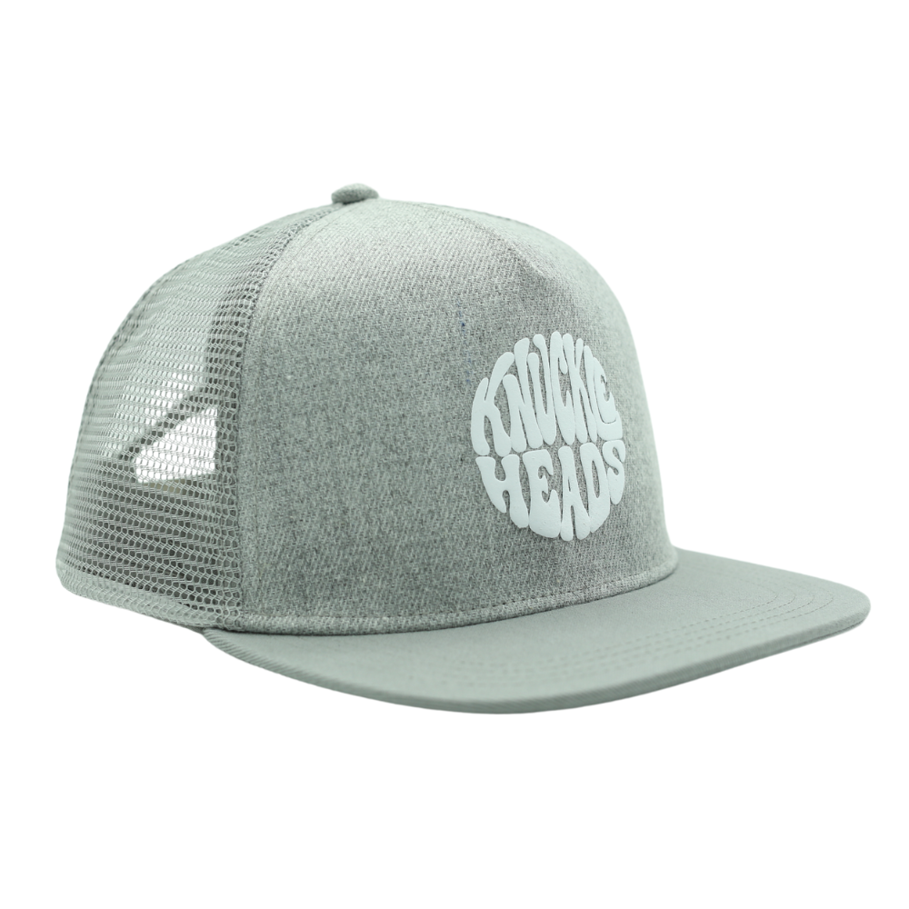 Image of Grey Bill Kids Trucker Hat with Knuckleheads Patch: A cool and trendy trucker hat designed for kids. The hat features a stylish tan crown and a brown bill, adorned with a striking Knuckleheads patch on the front. Elevate your child's style with this fashionable and comfortable accessory, perfect for any adventure or everyday wear. Crafted with care, this grey with grey bill trucker hat with a Knuckleheads patch is a must-have addition to their wardrobe.