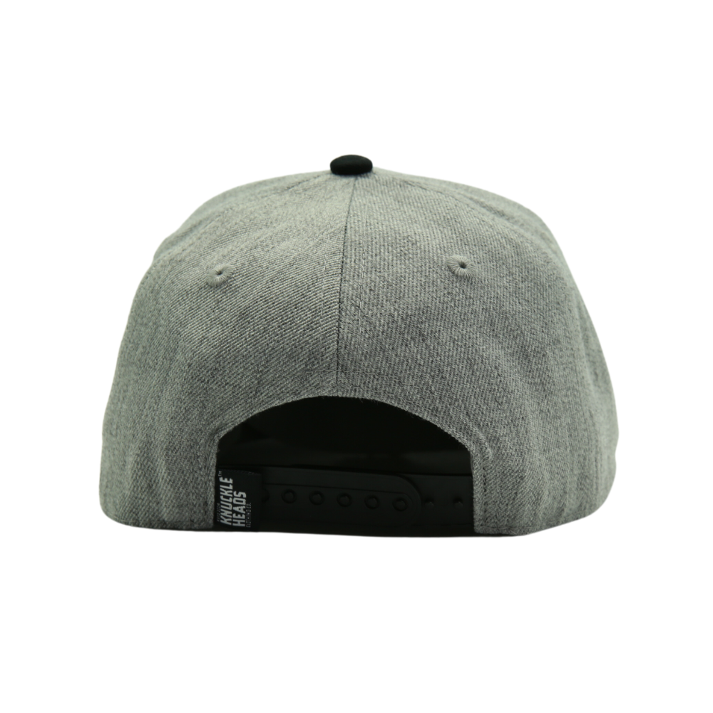 Presenting a Kids Trucker Hat in stylish Black and Grey, featuring an iconic Knuckleheads patch. This hat is specially designed for children, combining the versatile black and grey tones with the classic Knuckleheads patch. A standout accessory in our collection, it adds a touch of coolness and personality to your little one's look.