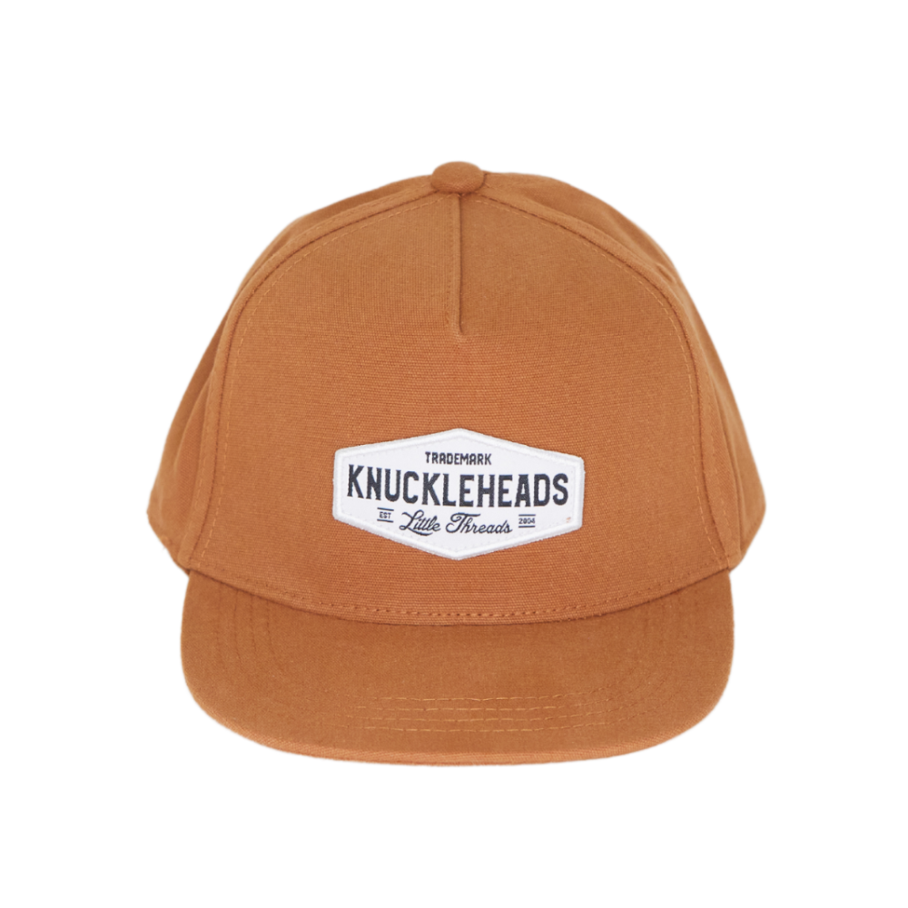 Image of Camel Kids Trucker Hat with Knuckleheads Patch: A stylish and versatile accessory designed for kids. In a warm camel color, it showcases a striking Knuckleheads patch on the front. Elevate your child's style with this fashionable hat, perfect for adding a touch of character to their outfits.