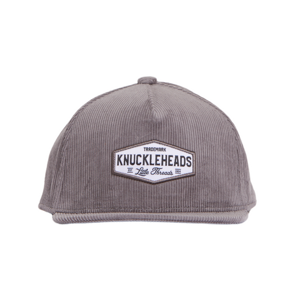 Image of Grey Corduroy Kids Trucker Hat with Knuckleheads Patch: A trendy and chic trucker hat designed for kids. The hat features a stylish grey corduroy fabric, adorned with a cool Knuckleheads patch on the front. Elevate your child's style with this fashionable and comfortable accessory, perfect for any outing or everyday wear. Crafted with care, this grey corduroy trucker hat with a Knuckleheads patch is a must-have addition to their wardrobe.
