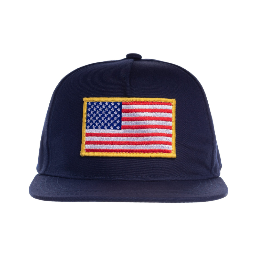 Image of Navy Kids Trucker Hat with USA Flag Patch: A patriotic and stylish accessory designed for kids. In deep navy, it features a prominent USA flag patch on the front. Elevate your child's style with this fashionable hat, perfect for adding a touch of national pride to their outfits. 