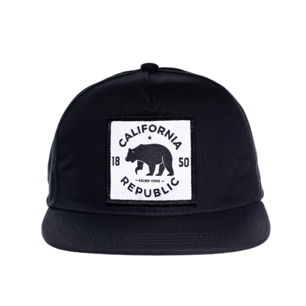 Introducing the California Republic Kids Trucker Hat: A cool and stylish accessory designed for kids. In sleek black, it features an eye-catching California Republic patch on the front. Elevate your child's style with this fashionable hat, perfect for showing their love for the Golden State. Crafted with care, this black kids trucker hat with the California Republic patch is a must-have addition to their wardrobe, suitable for various occasions and everyday wear.