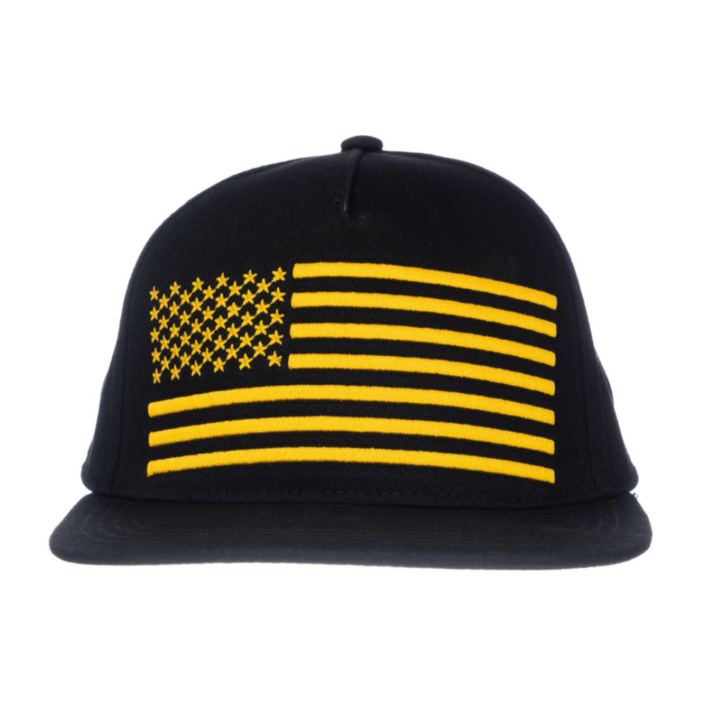 Image of Black Kids Trucker Hat with Gold USA Flag Patch: A patriotic and stylish accessory designed for kids. In classic black, it features a distinguished gold USA flag patch on the front. Elevate your child's style with this fashionable hat, perfect for adding a touch of elegance and national pride to their outfits.