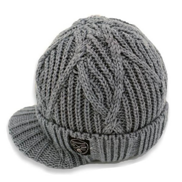 Image showcasing a grey beanie with a knitted pattern and visor by Knuckleheads, designed for children. This versatile beanie combines style and functionality with its knitted design and added visor, perfect for infants and toddlers. A unique addition to the collection of Infant hats, blending comfort and charm effortlessly.