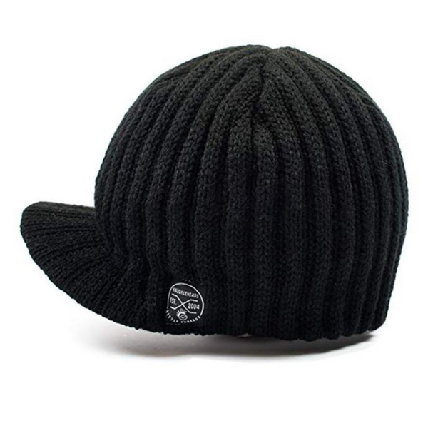 Photo of a black beanie designed for kids, featuring a prominent Knuckleheads tag. The beanie is accented with a stylish visor, combining comfort and urban style in one accessory.