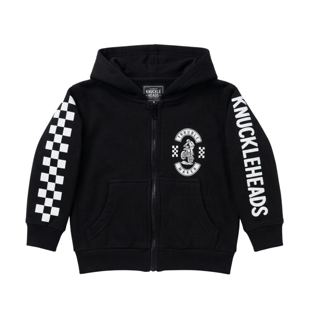 Black kids motocross zip hoodie with “Trouble Maker” dirt bike graphic, checkerboard racing sleeves, and Knuckleheads logo print.