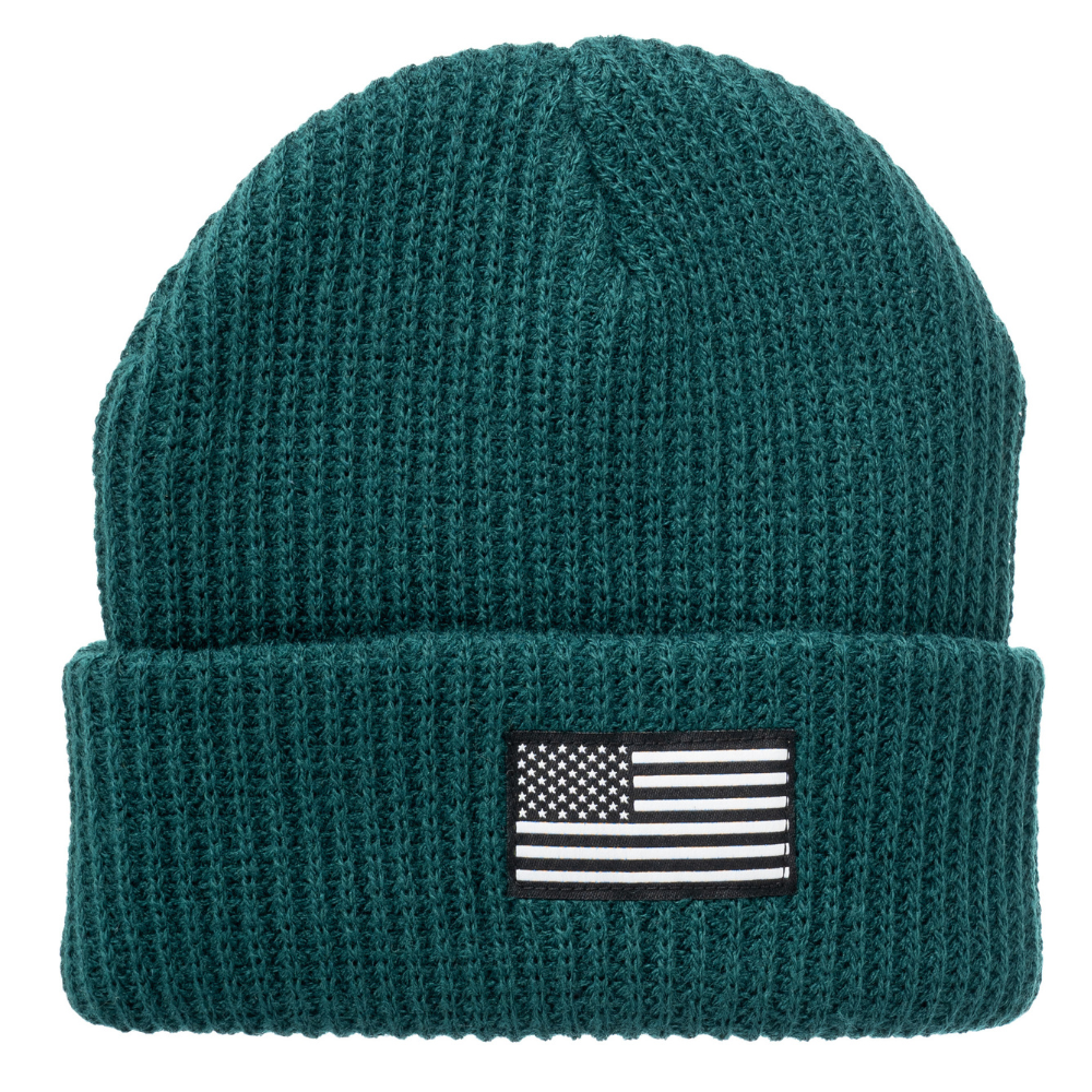 Image of a vibrant kids' beanie with a USA flag patch. This vibrant kids' beanie is designed to delight your child while keeping them cozy. Featuring a charming USA flag patch at the forefront, it adds a touch of patriotic flair to their outfit. Crafted with soft and comfortable materials, this beanie ensures warmth and comfort for your little one during chilly days. Whether they're heading to a Fourth of July celebration or just staying snug during winter.