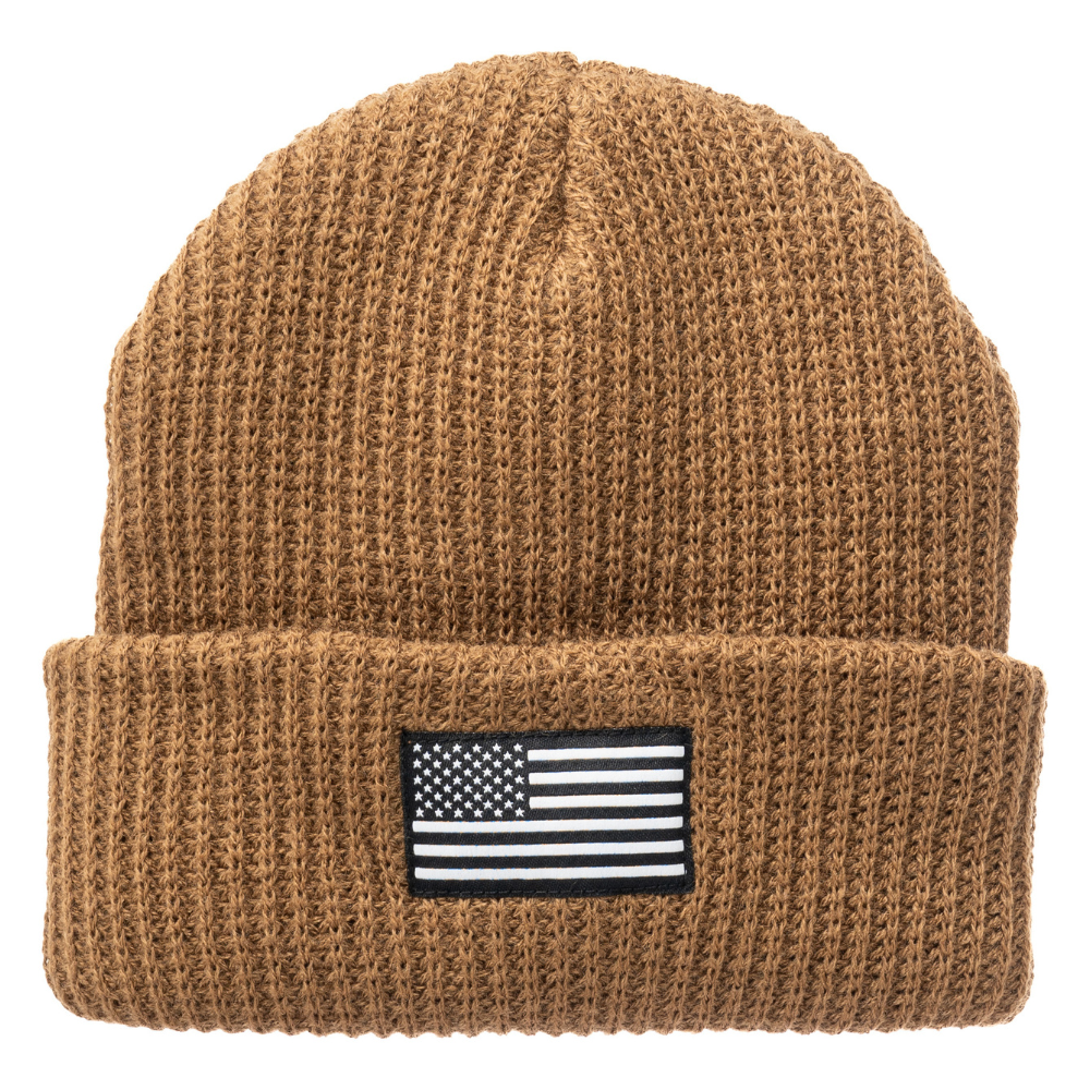 Image of a vibrant kids' beanie with a USA flag patch. This vibrant kids' beanie is designed to delight your child while keeping them cozy. Featuring a charming USA flag patch at the forefront, it adds a touch of patriotic flair to their outfit. Crafted with soft and comfortable materials, this beanie ensures warmth and comfort for your little one during chilly days. Whether they're heading to a Fourth of July celebration or just staying snug during winter.
