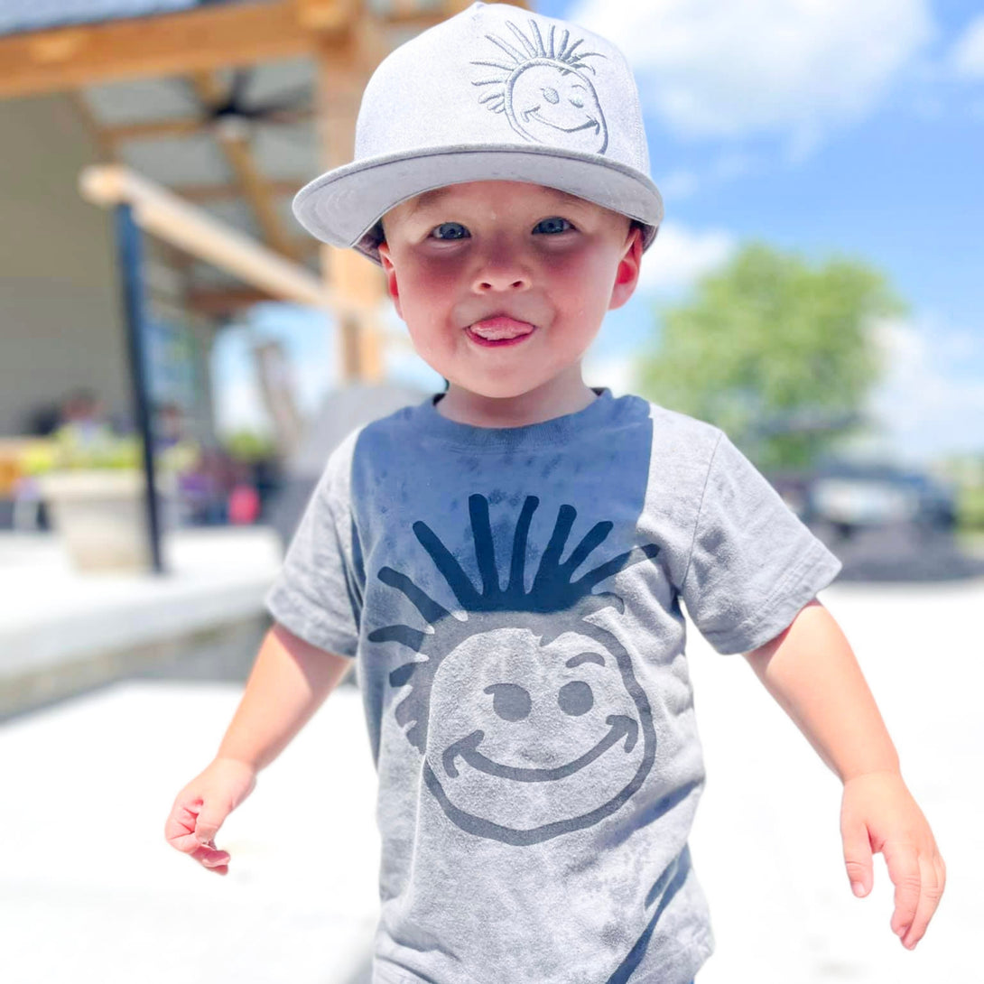 Image of Grey Kids Trucker Hat with Knuckleheads Logo: A stylish and versatile accessory designed for kids. In sleek grey, it showcases the iconic Knuckleheads logo on the front. Elevate your child's style with this fashionable hat, perfect for adding a touch of edgy flair to their outfits. 