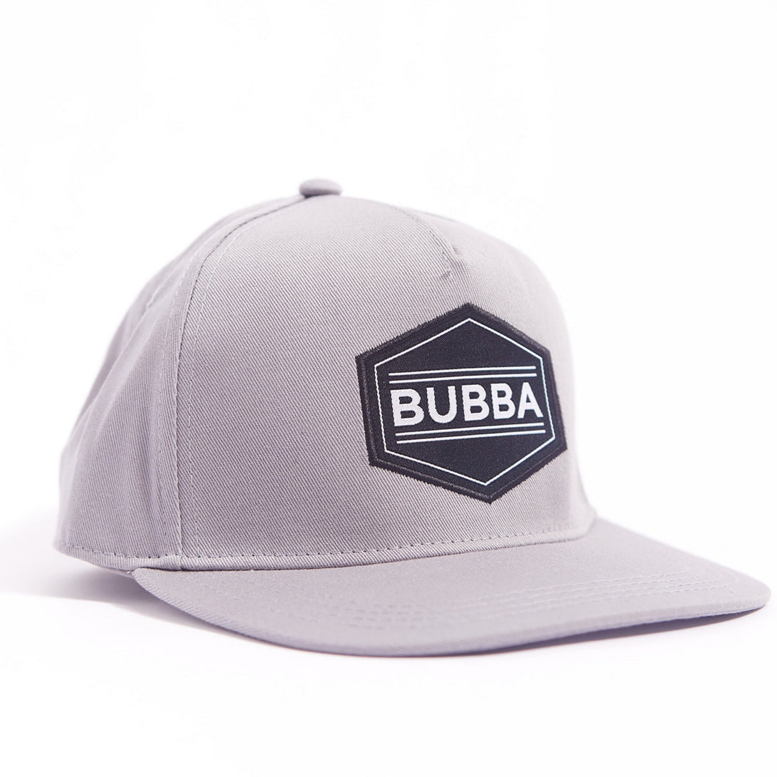 Introducing the Sleek Kids Trucker Hat with 'Bubba' Patch: A stylish and versatile accessory designed for kids. In a classic grey tone, it features a cool 'Bubba' patch on the front. Elevate your child's style with this fashionable hat, perfect for adding a touch of understated charm to any outfit. Crafted with care, this kids trucker hat with the 'Bubba' patch is a must-have addition to their wardrobe, suitable for various occasions and everyday wear.