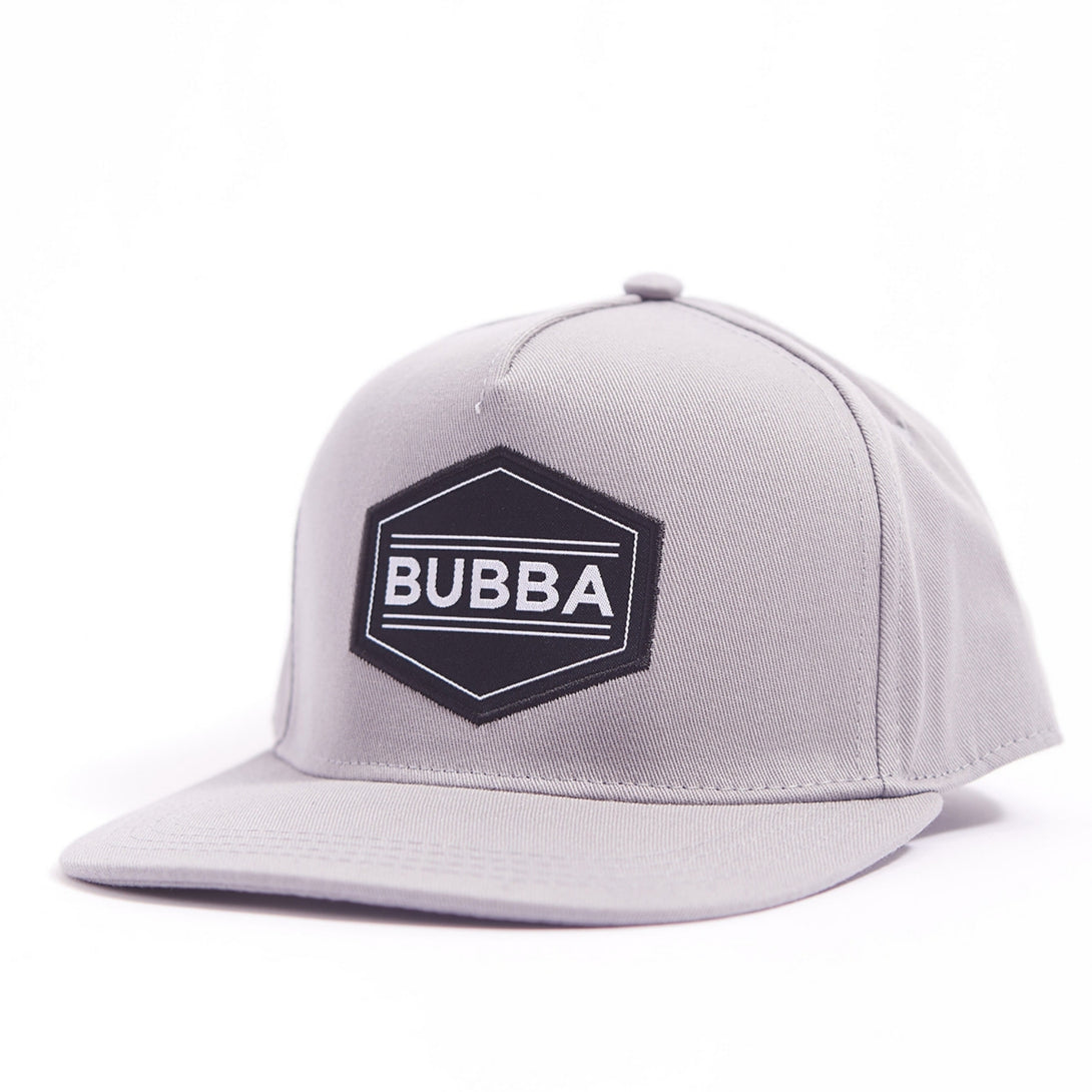 Introducing the Sleek Kids Trucker Hat with 'Bubba' Patch: A stylish and versatile accessory designed for kids. In a classic grey tone, it features a cool 'Bubba' patch on the front. Elevate your child's style with this fashionable hat, perfect for adding a touch of understated charm to any outfit. Crafted with care, this kids trucker hat with the 'Bubba' patch is a must-have addition to their wardrobe, suitable for various occasions and everyday wear.
