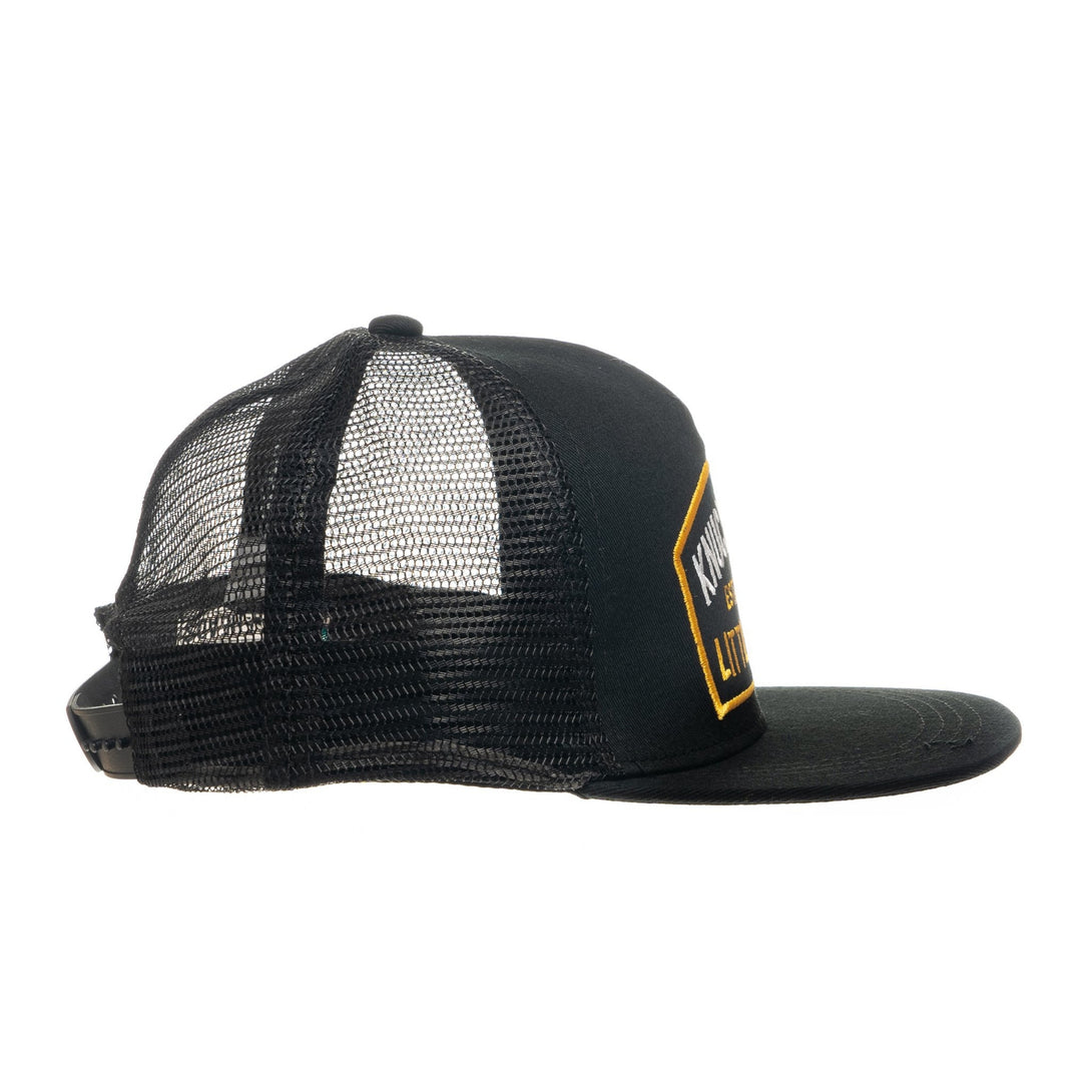 Image of Black Kids Trucker Hat with Black Mesh and Knuckleheads Patch: A sleek and stylish accessory designed for kids. In classic black with matching black mesh, it showcases a striking Knuckleheads patch on the front. Elevate your child's style with this fashionable hat, perfect for adding a touch of edgy flair to their outfits while ensuring breathability. 