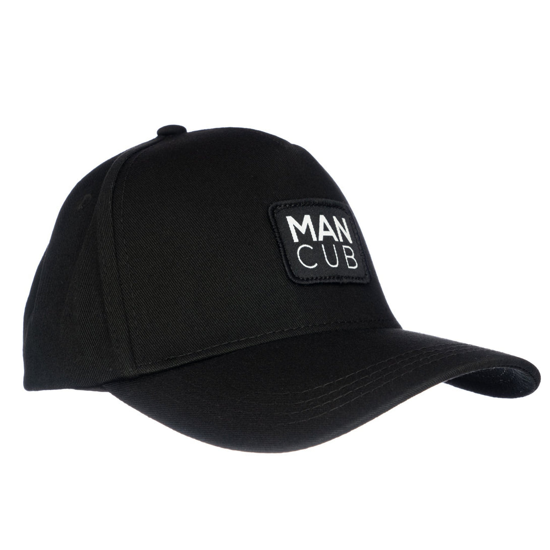 Image of Black Kids Trucker Hat with 'Man Cub' Patch: A cool and stylish accessory designed for kids. In classic black, it features an adorable 'Man Cub' patch on the front. Elevate your child's style with this fashionable hat, perfect for adding a playful touch to their outfits. Crafted with care, this black kids trucker hat with the 'Man Cub' patch is a must-have addition to their wardrobe, suitable for various occasions and everyday wear.