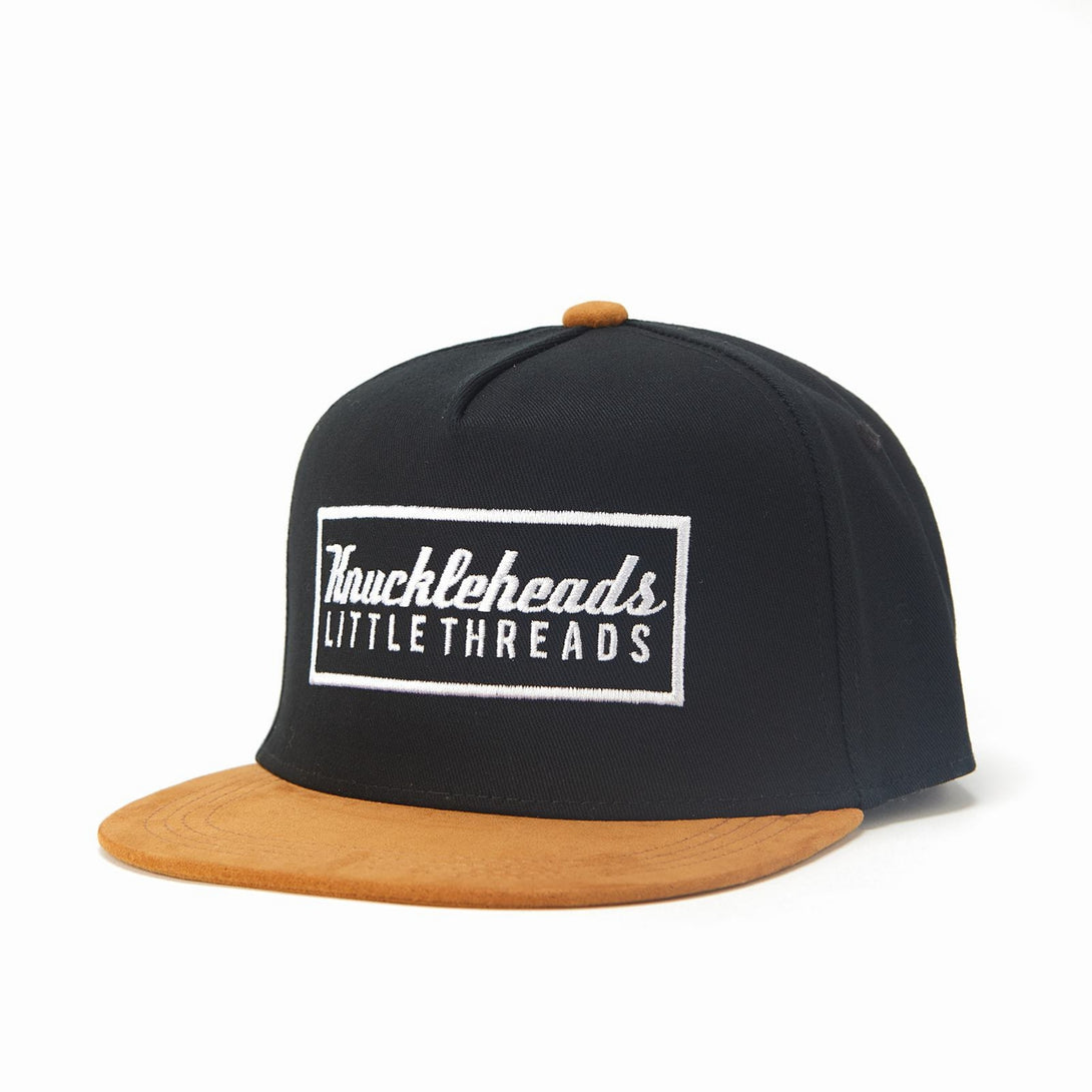 Image of Black and Brown Kids Trucker Hat with Knuckleheads Patch: A stylish and versatile accessory designed for kids. Combining sleek black and warm brown tones, it showcases a striking Knuckleheads patch on the front. Elevate your child's style with this fashionable hat, perfect for adding a touch of contrast to their outfits. Crafted with care, this black and brown kids trucker hat with the Knuckleheads patch is a must-have addition to their wardrobe, suitable for various occasions and everyday wear.