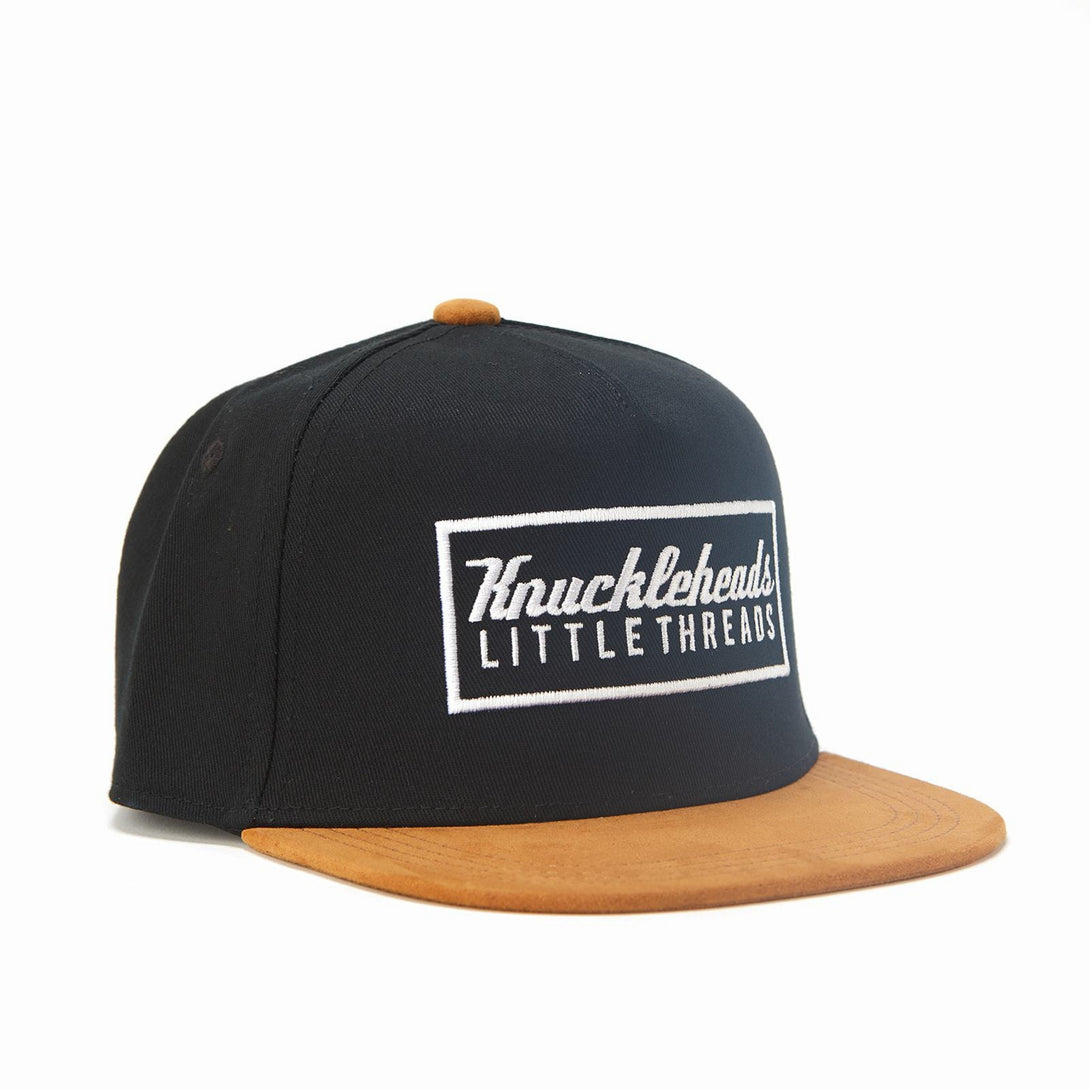 Image of Black and Brown Kids Trucker Hat with Knuckleheads Patch: A stylish and versatile accessory designed for kids. Combining sleek black and warm brown tones, it showcases a striking Knuckleheads patch on the front. Elevate your child's style with this fashionable hat, perfect for adding a touch of contrast to their outfits. Crafted with care, this black and brown kids trucker hat with the Knuckleheads patch is a must-have addition to their wardrobe, suitable for various occasions and everyday wear.