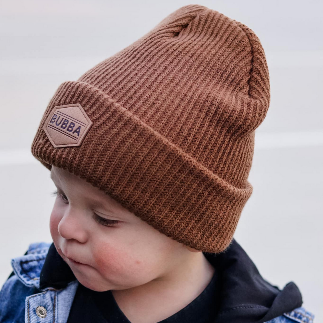 Image of Brown Kids Beanie with Bubba Logo: A trendy and snug accessory for kids. In a charming green shade, it features the distinctive Bubba logo on the front. Keep your child both stylish and warm with this fashionable beanie, perfect for adding a touch of character to their outfits. Crafted with care, this green kids beanie with the Bubba logo is a must-have addition to their winter wardrobe, suitable for various occasions and everyday wear.