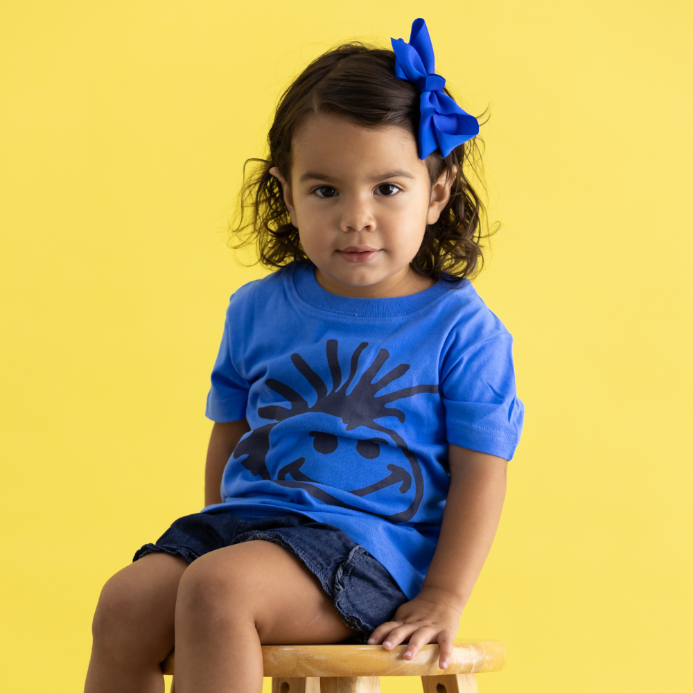 Image of Knuckleheads Logo Blue Kids T-Shirt: A cool and stylish blue tee featuring the iconic Knuckleheads logo. Crafted with care for maximum comfort and durability. Versatile and trendy, perfect for young trendsetters. Soft and breathable fabric ensures a cozy fit for all-day wear. Elevate your child's style with this striking addition to their wardrobe.