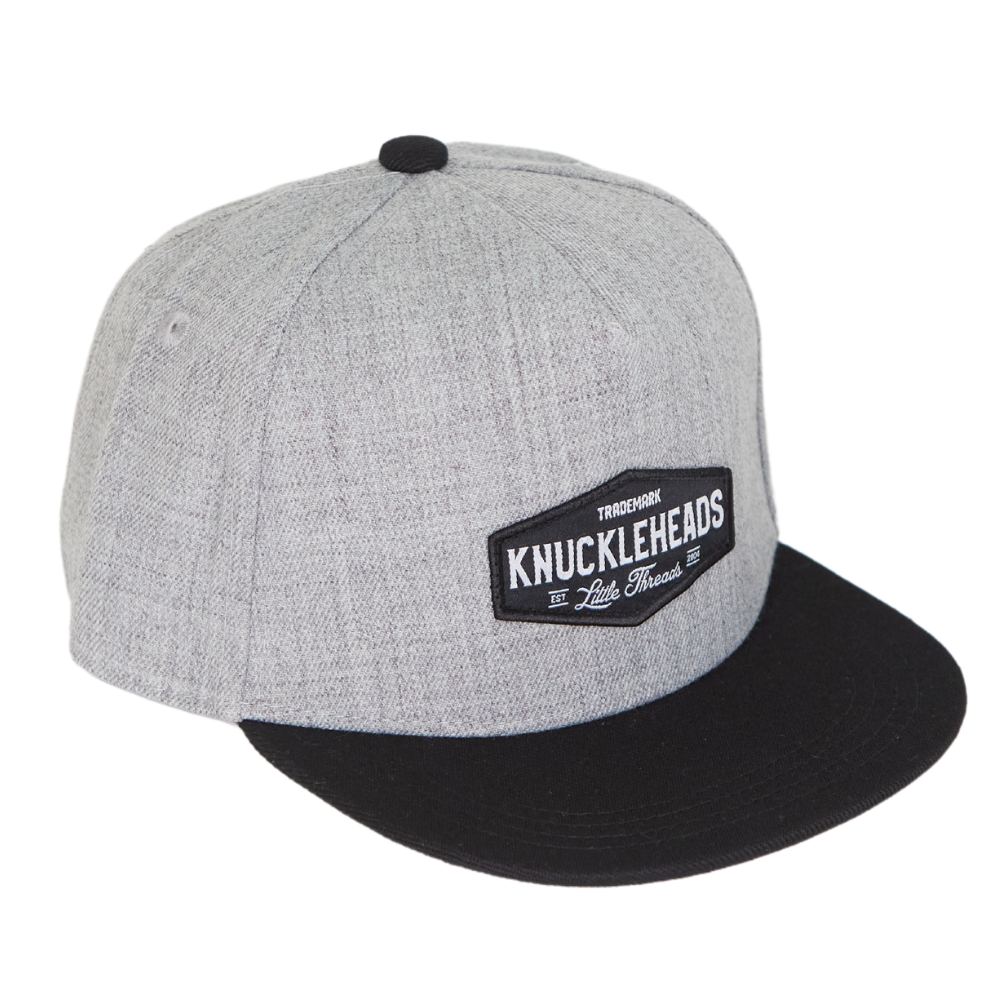 Image of Black and Grey Kids Trucker Hat with Knuckleheads Patch: A trendy and versatile accessory designed for kids. Combining sleek black and cool grey tones, it features a striking Knuckleheads patch on the front. Elevate your child's style with this fashionable hat, perfect for adding a touch of edgy flair to their outfits. 
