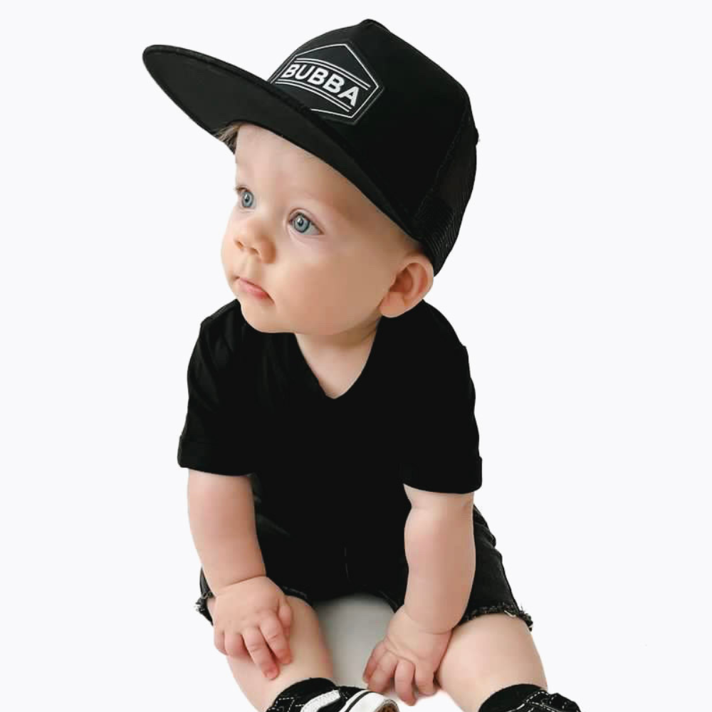Introducing the Stylish Kids Trucker Hat with 'Bubba' Patch and Sun Mesh: A versatile and practical accessory designed for kids. In sleek black, it features a playful 'Bubba' patch on the front and sun mesh for added breathability. Elevate your child's style with this fashionable and comfortable hat, perfect for outdoor adventures and everyday wear.