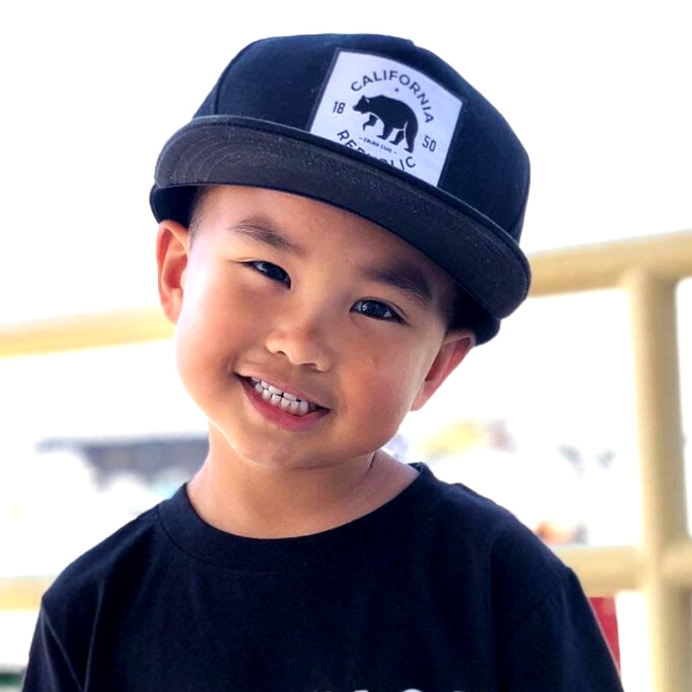 Introducing the California Republic Kids Trucker Hat: A cool and stylish accessory designed for kids. In sleek black, it features an eye-catching California Republic patch on the front. Elevate your child's style with this fashionable hat, perfect for showing their love for the Golden State. Crafted with care, this black kids trucker hat with the California Republic patch is a must-have addition to their wardrobe, suitable for various occasions and everyday wear.