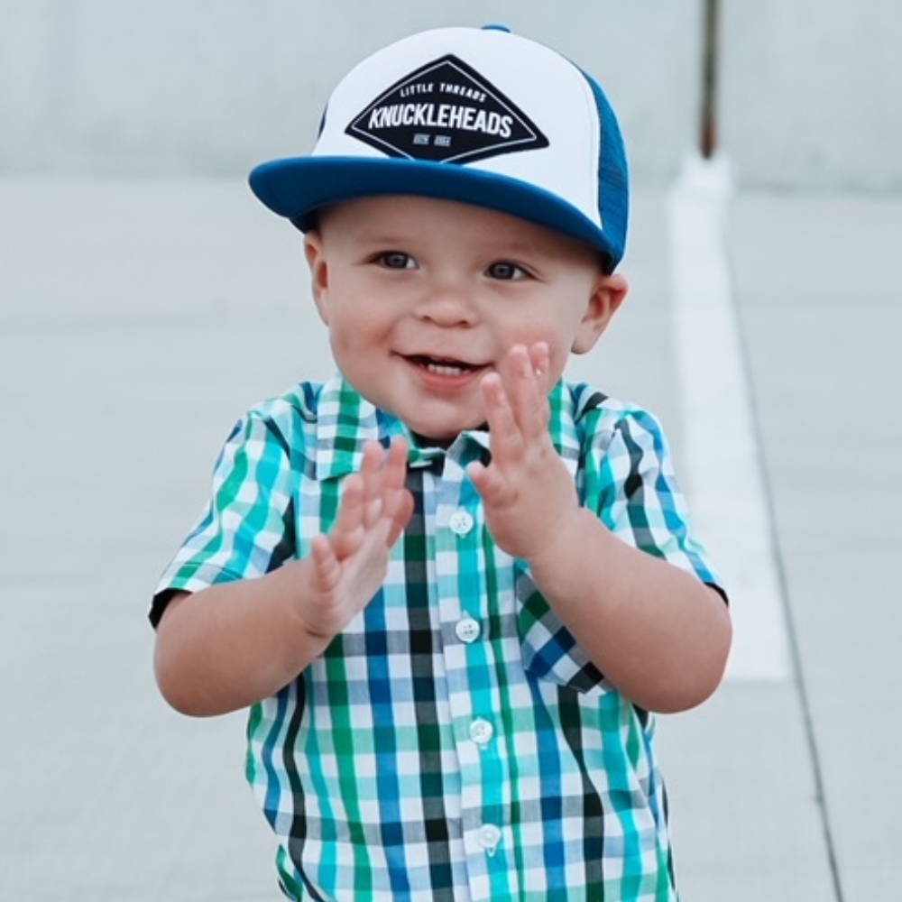 Image of Blue Kids Trucker Hat with Knuckleheads Patch: A stylish and versatile accessory designed for kids. In a captivating blue hue, it showcases a striking Knuckleheads patch on the front. Elevate your child's style with this fashionable hat, perfect for adding a pop of color to their outfits.