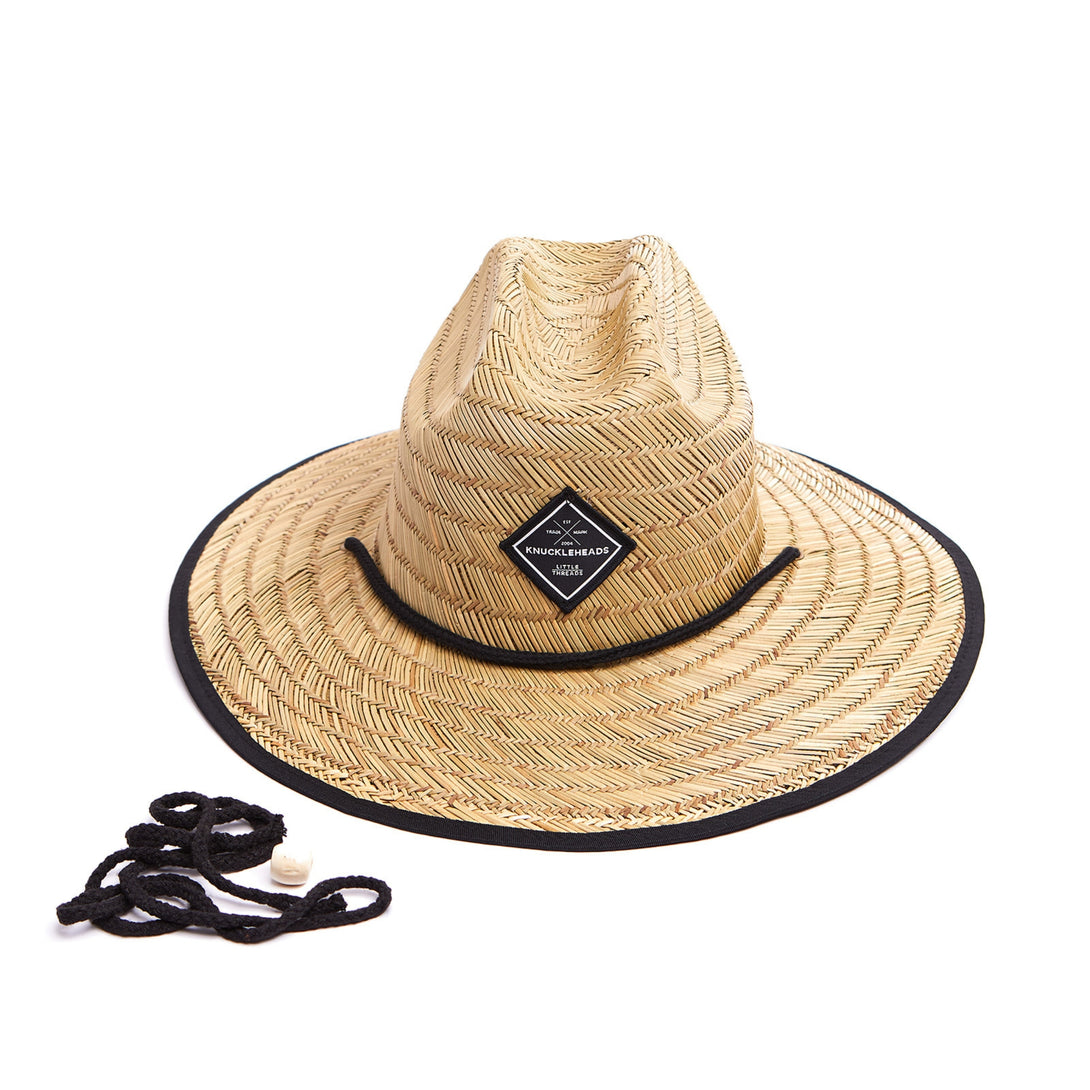 Image of a fashionable kids' straw hat featuring a distinctive Knuckleheads patch, elevating your child's outfit with a dash of unique style. This trendy accessory not only shields them from the sun's rays but also showcases their individuality. Whether they're headed to a picnic, a day at the beach, or any sunny adventure, this hat is the perfect addition to complete their look while keeping them cool and shaded.