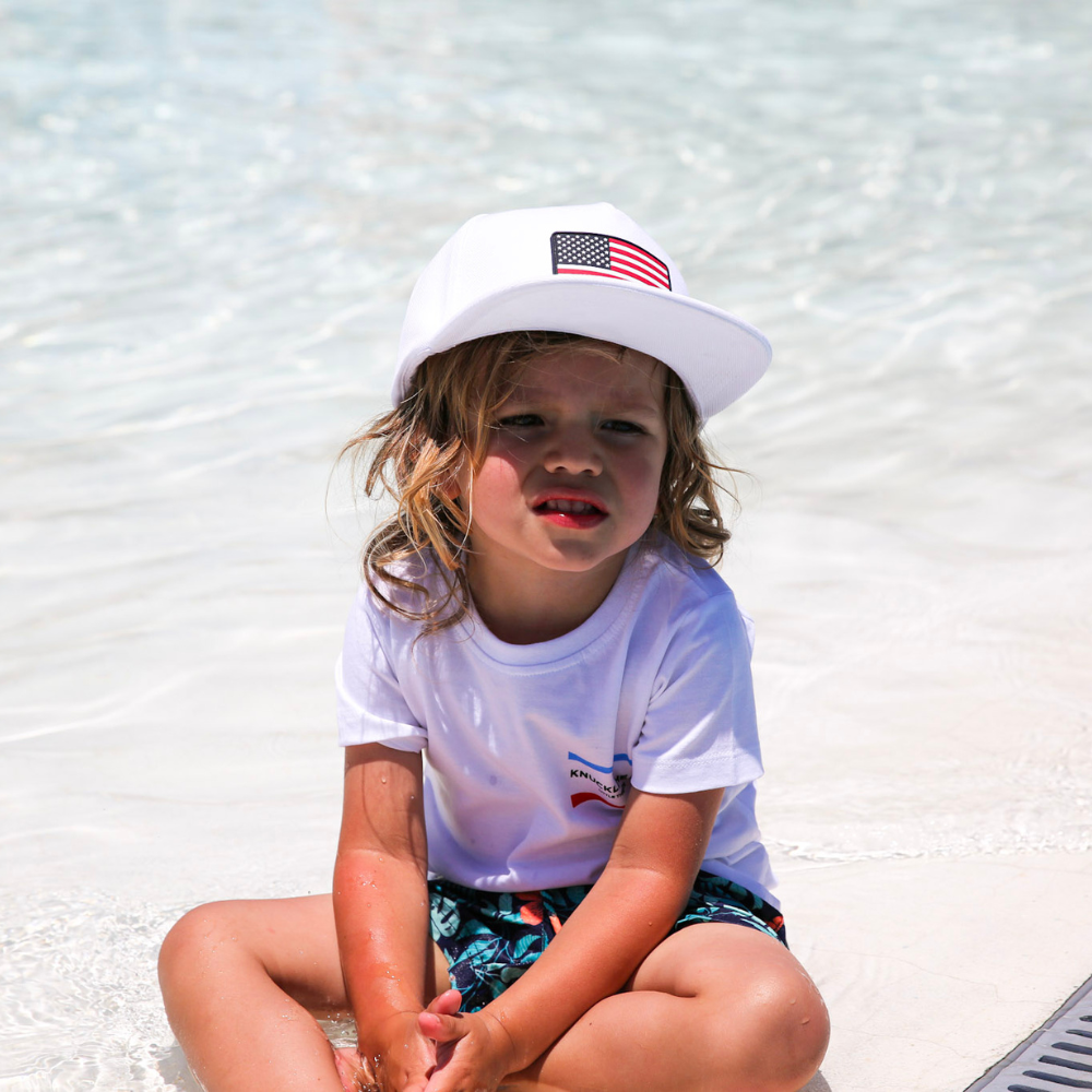 Image of "Merica Kids T-Shirt": A vibrant and trendy tee celebrating American spirit with stars and stripes design. Made of soft cotton for all-day comfort and durability. Perfect for Independence Day and beyond, expressing patriotic pride. Ideal for active kids, showcasing their love for the USA in style.